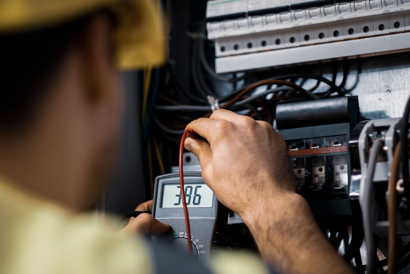 Electrician repairing electric panel